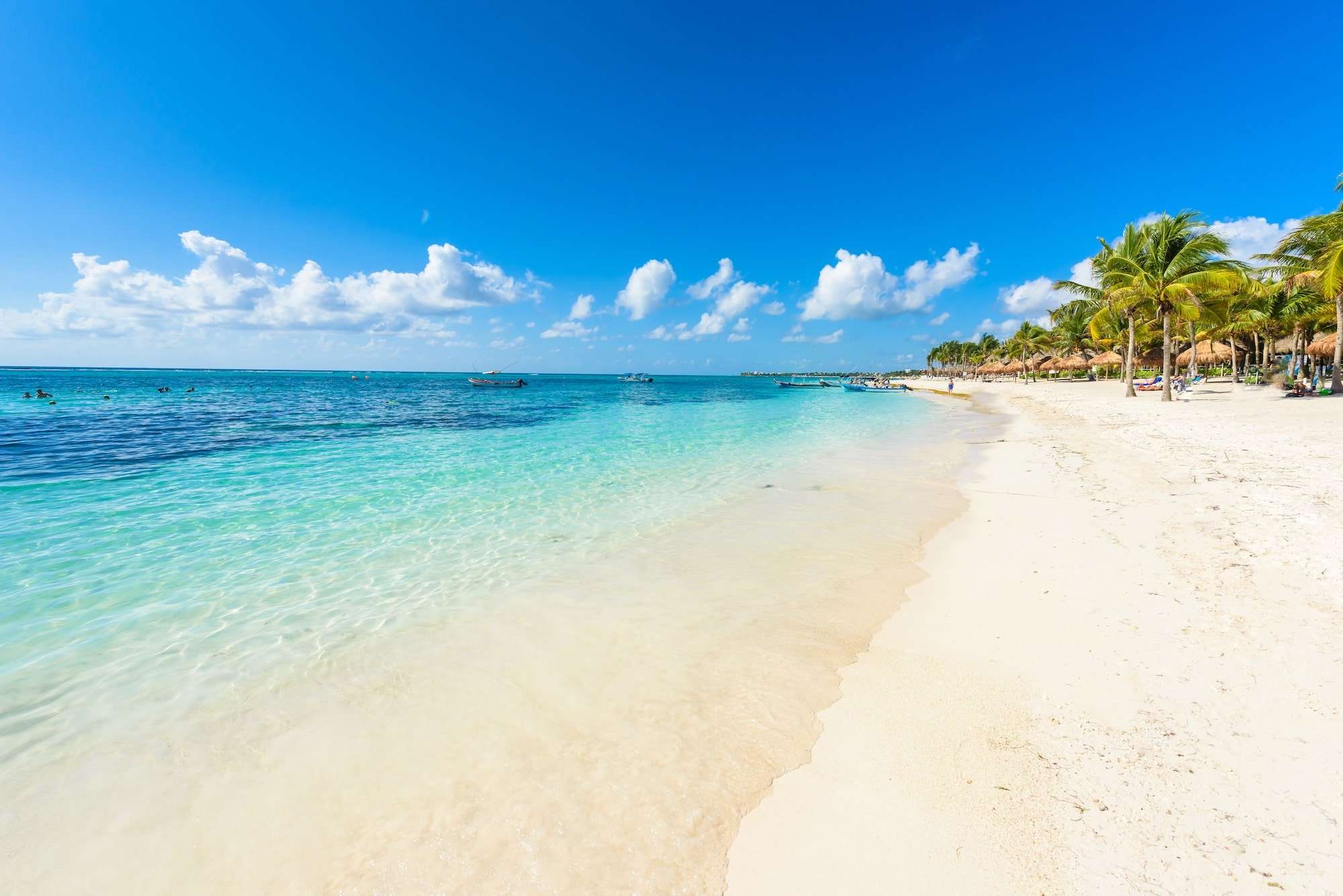 The Ultimate Tulum Travel Guide: Secrets of the Riviera Maya Unveiled 1 Beach with boats and tourists