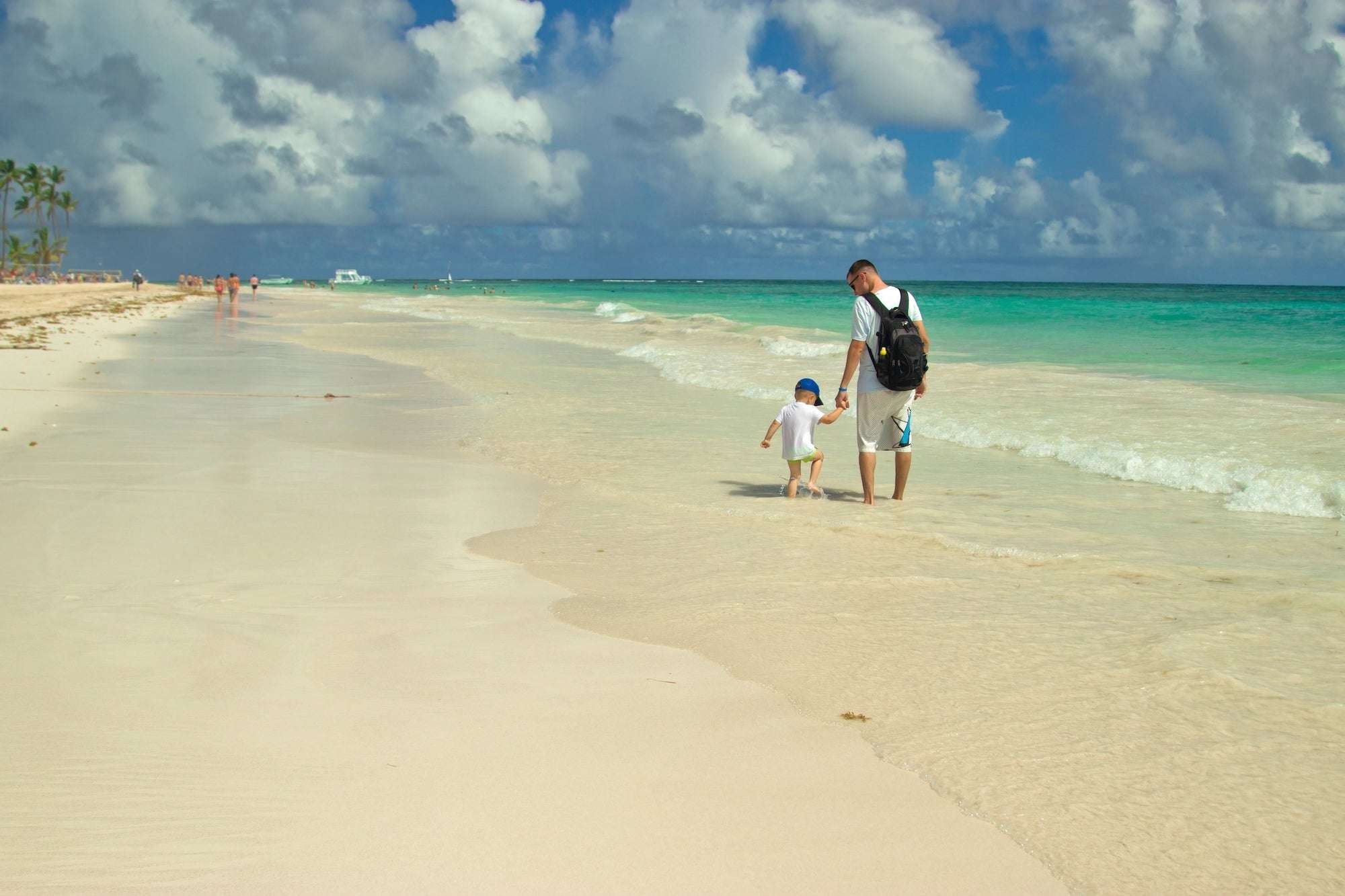 Family Fun in the Sun: Top Playa del Carmen Activities for All Ages 1 Dad and son are walking along the beach