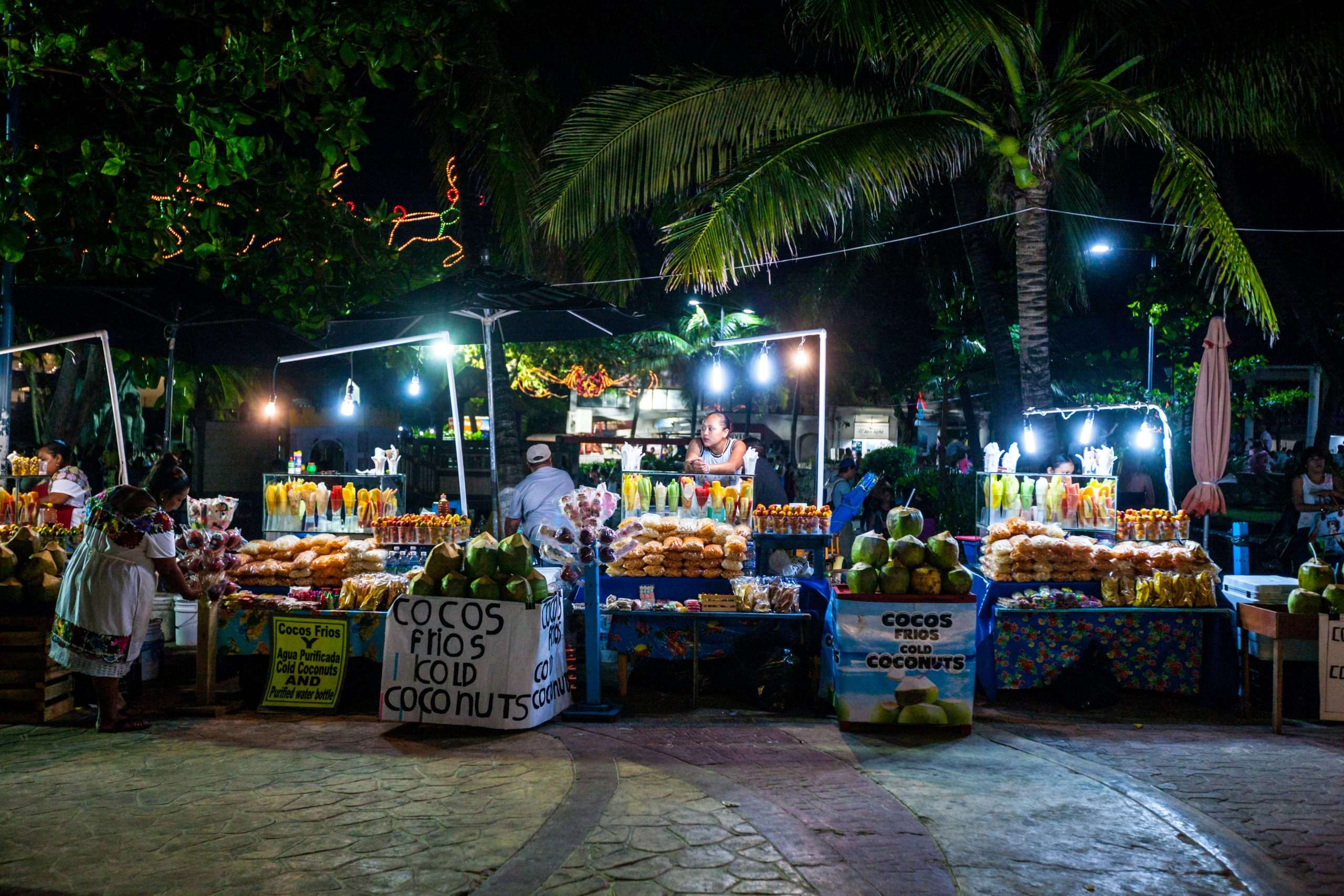 The Hidden Gem Between Tulum and Playa Del Carmen: A Complete Traveler's Guide to Akumal 6 Street market selling coconut drinks and snacks in Playa Del Carmen, Mexico