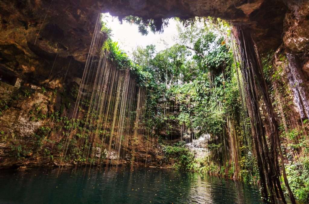 Traditions and Temples: Cultural Day Trips in and Around Playa del Carmen 6 Ik Kil Cenote Mexico min