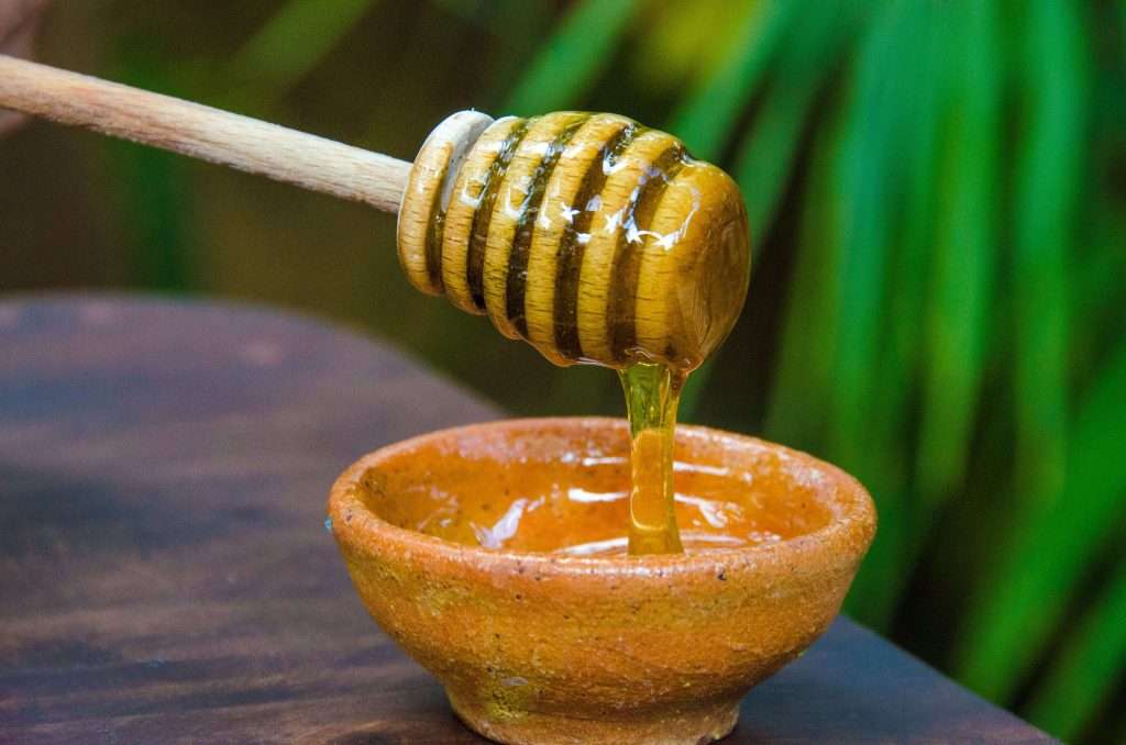 Tulum's Cultural Tapestry: An Immersive Experience 2 Honey Dripping Into Bowl