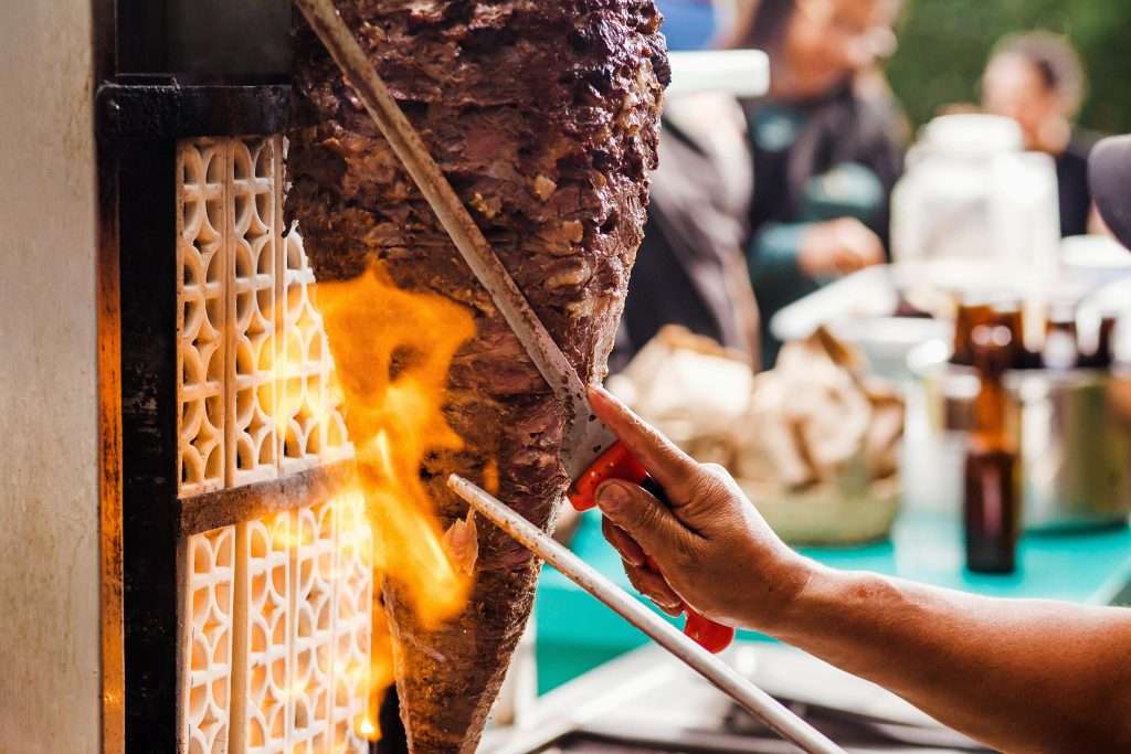 Culinary Quest: Savoring Playa del Carmen's Best Eats 1 Meat Being Cut Off Spit
